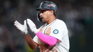 Seattle Mariners' Josh Naylor reacts after hitting a single during the seventh inning in Game 5 of baseball's American League Division Series against the Detroit Tigers, Friday, Oct. 10, 2025, in Seattle. (Lindsey Wasson/AP Photo)