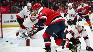 Washington Capitals left winger Alex Ovechkin shoots against Ottawa Senators centre Ridly Greig (71) and goaltender Linus Ullmark, left, during the first period of an NHL game, Saturday, Oct. 25, 2025, in Washington. (Nick Wass/AP)