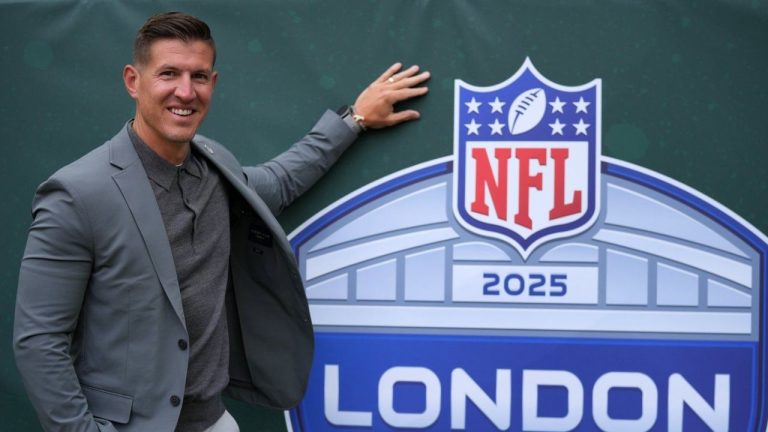 NFL field director, Nick Pappas poses for a photo before the NFL football game between the Denver Broncos and the New York Jets, Sunday, Oct. 12, 2025, in London. (Kin Cheung/AP)