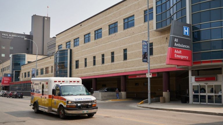 An ambulance drives past Health Sciences Centre in Winnipeg on Thursday, June 15, 2023. (David Lipnowski/CP)