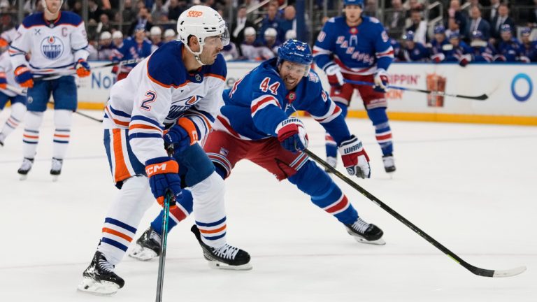 New York Rangers' Vladislav Gavrikov (44) defends Edmonton Oilers' Evan Bouchard (2) during the first period of an NHL hockey game Tuesday, Oct. 14, 2025, in New York. (Frank Franklin II/AP)