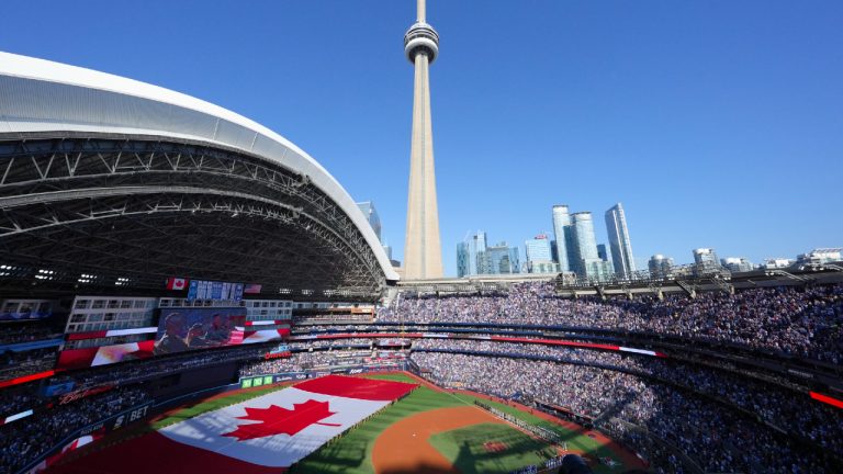 The Canadian flag is displayed on the field during an anthems ceremony ahead of the start of the American League Division Series MLB playoff series between the Toronto Blue Jays and the New York Yankees in Toronto on Saturday, October 4, 2025. (Chris Young/CP)
