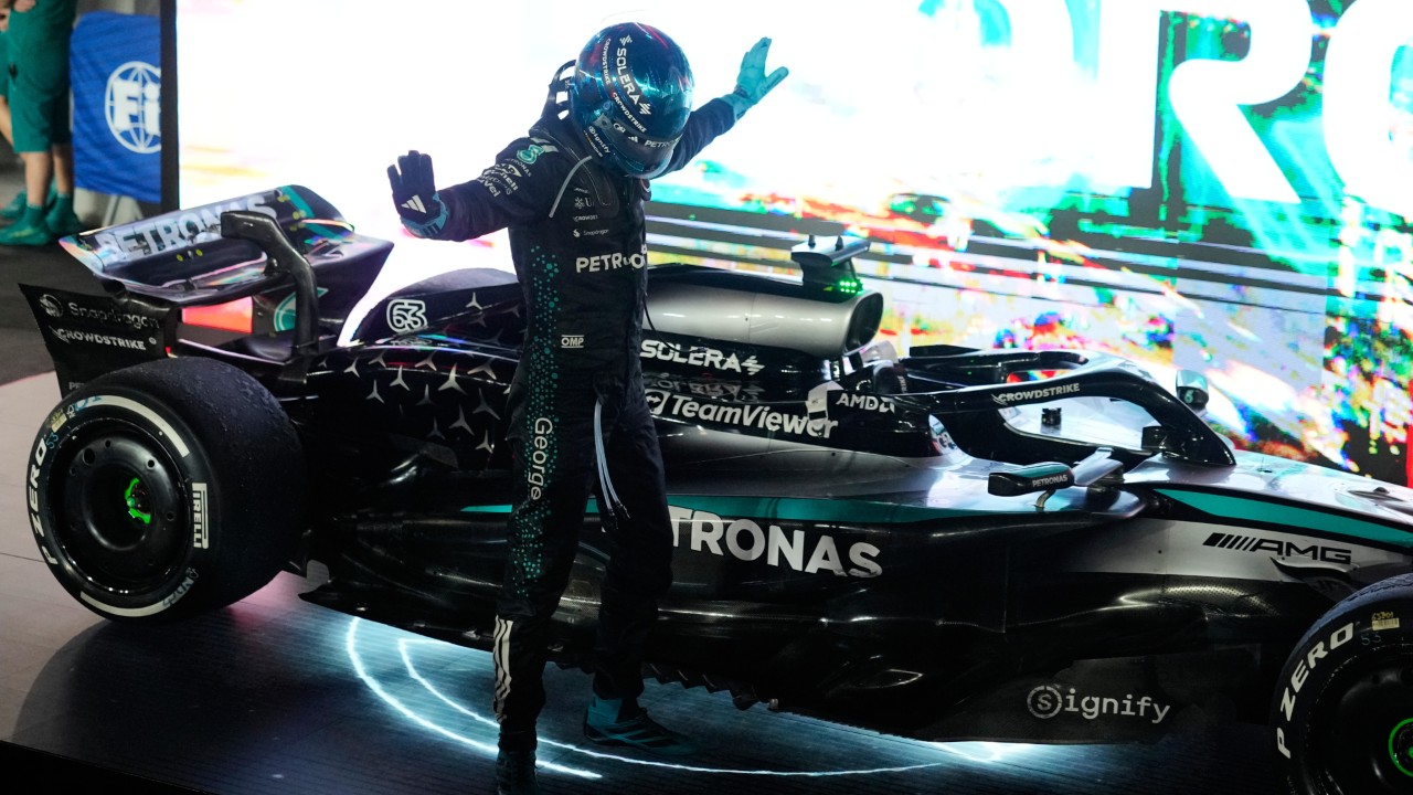 Mercedes driver George Russell of Britain celebrates after winning the Singapore Formula One Grand Prix at the Marina Bay Street Circuit in Singapore, Sunday, Oct. 5, 2025. (Vincent Thian/AP)