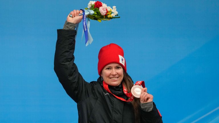 Tatyana Ivanova, of Russian Olympic Committee, celebrates winning the bronze medal in the luge women's singles at the 2022 Winter Olympics, Tuesday, Feb. 8, 2022, in the Yanqing district of Beijing. (Mark Schiefelbein/AP)