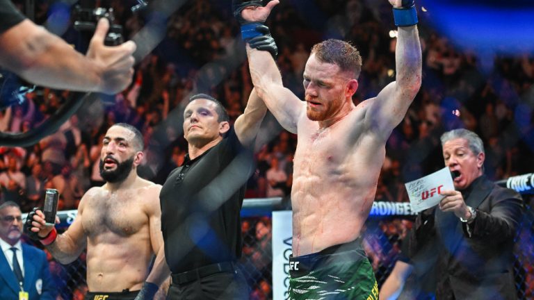 Jack Della Maddalena, right, reacts following his win over Belal Muhammad, left, following their UFC 315 mixed martial arts welterweight title bout in Montreal, Sunday, May 11, 2025. (Graham Hughes/CP)