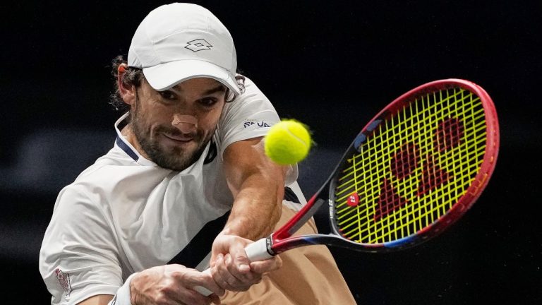 Vacherot of Monaco serves the ball to Cameron Norrie of Great Britain during their third round men's singles match at the Paris Masters tennis tournament at the Paris La Defense Arena, Thursday, Oct. 30, 2025, in Paris. (Michel Euler/AP)