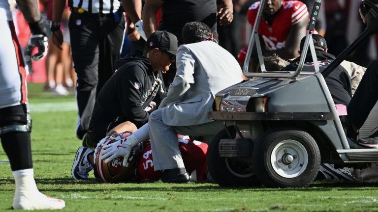San Francisco 49ers middle linebacker Fred Warner (54) is tended to after being injured during the first half of an NFL football game against the Tampa Bay Buccaneers in Tampa, Fla., Sunday, Oct. 12, 2025. (Jason Behnken/AP Photo)