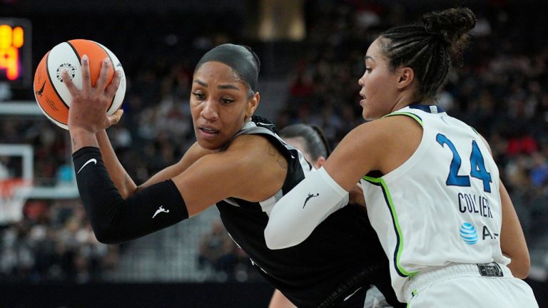 Las Vegas Aces centre A'ja Wilson, left, drives against Minnesota Lynx forward Napheesa Collier (24) during the first half of a WNBA basketball game Thursday, Sept. 4, 2025, in Las Vegas. (John Locher/AP)
