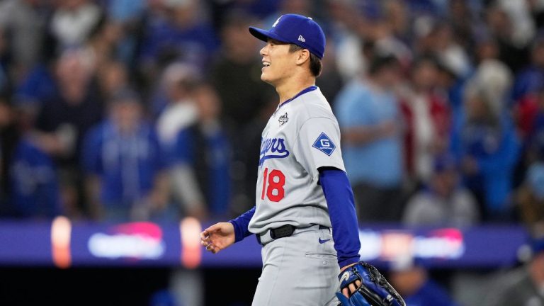 Los Angeles Dodgers pitcher Yoshinobu Yamamoto celebrates after throwing compete game against the Toronto Blue Jays in Game 2 of baseball's World Series, Saturday, Oct. 25, 2025, in Toronto. (Brynn Anderson/AP)