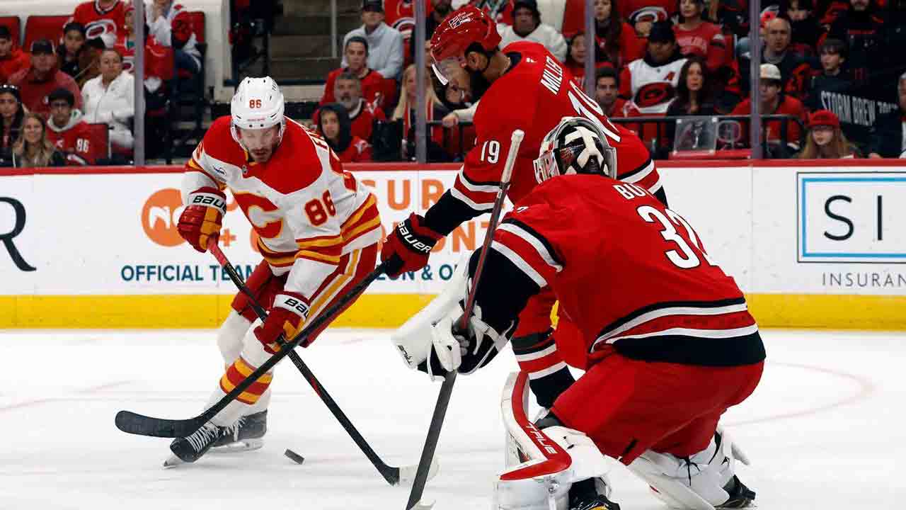 Flames can’t solve Bussi in OT loss to Hurricanes