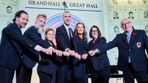 Hockey Hall of Fame inductees Duncan Keith, left to right, Joe Thornton, Brianna Decker, Zdeno Chara, Jennifer Botterill, Danièle Sauvageau and Jack Parker pose for a photograph with their rings in Toronto, on Saturday, Nov. 8, 2025. (Sammy Kogan/CP)