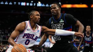 Philadelphia 76ers guard Tyrese Maxey, left, drives against Detroit Pistons guard Javonte Green during the first half of an NBA Cup basketball game Friday, Nov. 14, 2025, in Detroit. (Ryan Sun/AP)