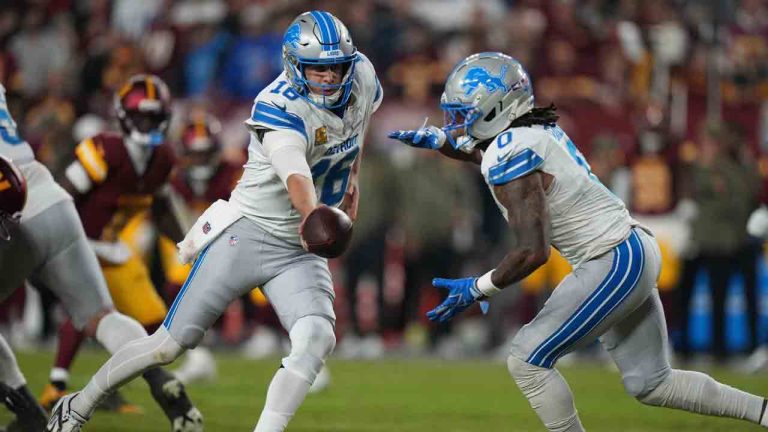 Detroit Lions quarterback Jared Goff (16) hands off to running back Jahmyr Gibbs (0) during the first half of an NFL football game against the Washington Commanders Sunday, Nov. 9, 2025, in Landover, Md. (Stephanie Scarbrough/AP)