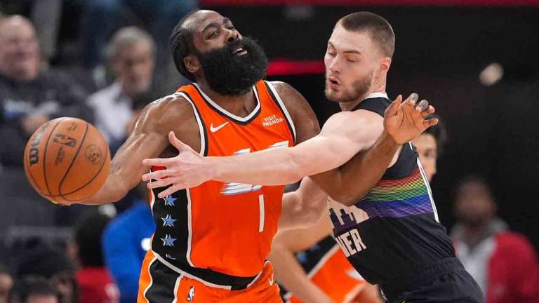 Denver Nuggets guard Christian Braun, right, reaches in on Los Angeles Clippers guard James Harden during the first half of an NBA basketball game Wednesday, Nov. 12, 2025, in Inglewood, Calif. (Mark J. Terrill/AP)