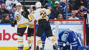Boston Bruins' David Pastrnak (left) celebrates his goal with teammates Marat Khusnutdinov (second left) and Morgan Geekie (39) during second period NHL hockey action against the Toronto Maple Leafs in Toronto, on Saturday, Nov. 8, 2025. (Sammy Kogan/CP)