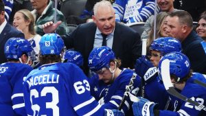 Toronto Maple Leafs head coach Craig Berube speaks with this players during a timeout in second period NHL hockey action against the Nashville Predators in Toronto on Tuesday, October 14, 2025. (Nathan Denette/CP)