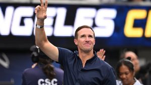 FILE - Former quarterback Drew Brees waves to the crowd during the first half of an NFL game between the Los Angeles Chargers and the Denver Broncos, Sunday, Sept. 21, 2025, in Inglewood, Calif. (AP/Carrie Giordano, File)