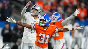 Denver Broncos' Kris Abrams-Draine (31) reacts to a missed field goal attempt by Las Vegas Raiders kicker Daniel Carlson, left, during the second half of an NFL football game Thursday, Nov. 6, 2025, in Denver. (AP Photo/Jack Dempsey)