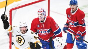 Montreal Canadiens goaltender Sam Montembeault (35) and Arber Xhekaj (72) look on as Boston Bruins' Tanner Jeannot (84) celebrates a goal by teammate Mason Lohrei during second period NHL hockey action in Montreal, Saturday, Nov. 15, 2025. THE CANADIAN PRESS/Graham Hughes