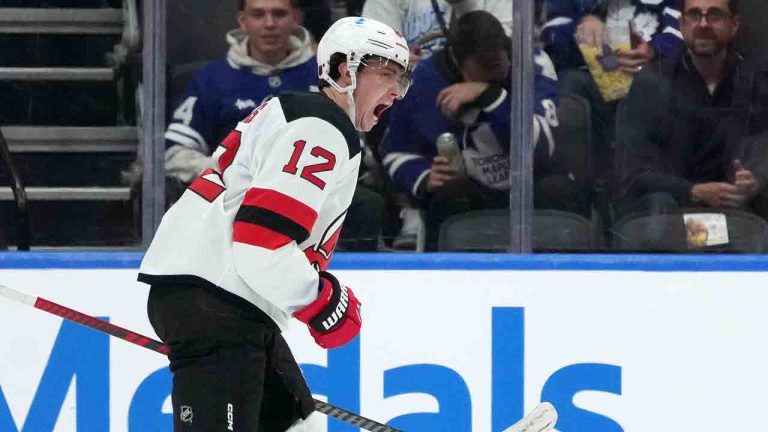 New Jersey Devils centre Cody Glass (12) celebrates his goal during second period NHL hockey action against the Toronto Maple Leafs, in Toronto, Tuesday, Oct. 21, 2025. (Nathan Denette/CP)
