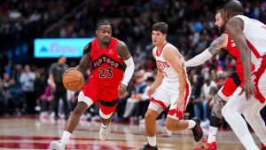 Toronto Raptors guard Jamal Shead (23) dribbles the ball during the second half of preseason NBA basketball action in Toronto, Wednesday, Oct. 29, 2025. (Thomas Skrlj/CP)