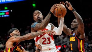 Toronto Raptors guard Jamal Shead (23) drives against Atlanta Hawks guard Keaton Wallace (2) during the first half of an NBA basketball game, Friday, Nov. 7, 2025, in Atlanta. (Mike Stewart/AP Photo)