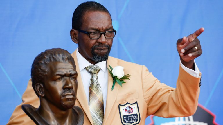 Former NFL player Kenny Easley poses with a bust of himself during an induction ceremony at the Pro Football Hall of Fame, Saturday, Aug. 5, 2017, in Canton, Ohio. (Ron Schwane/AP)