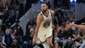Golden State Warriors guard Stephen Curry (30) reacts after making a 3-point basket in front of Utah Jazz forward Kyle Anderson, bottom middle, during the first half of an NBA basketball game in San Francisco, Monday, Nov. 24, 2025. (Jeff Chiu/AP)