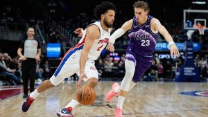 Detroit Pistons guard Cade Cunningham, left, drives against Utah Jazz forward Lauri Markkanen during the first half of an NBA basketball game Wednesday, Nov. 5, 2025, in Detroit. (Ryan Sun/AP)