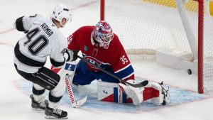 Los Angeles Kings' Joel Armia (40) scores on Montreal Canadiens goaltender Sam Montembeault (35) during third period NHL hockey action in Montreal on Tuesday, Nov. 11, 2025. THE CANADIAN PRESS/Christinne Muschi