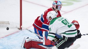 Dallas Stars' Tyler Seguin (91) scores on Montreal Canadiens goaltender Jakub Dobes (75) during second period NHL hockey action in Montreal on Thursday, Nov. 13, 2025. (Christinne Muschi/CP)