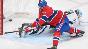 Montreal Canadiens' Kirby Dach (77) scores against Utah Mammoth goaltender Karel Vejmelka during third period NHL hockey action in Montreal, Saturday, Nov. 8, 2025. (Graham Hughes/CP)