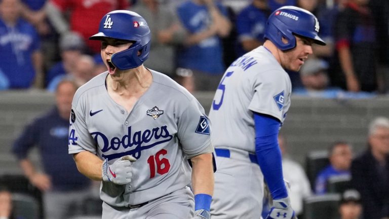 Los Angeles Dodgers' Will Smith celebrates with Freddie Freeman after a home run against the Toronto Blue Jays during the11th inning in Game 7 of baseball's World Series, Sunday, Nov. 2, 2025, in Toronto. (AP Photo/Brynn Anderson)