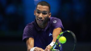 Canada's Felix Auger-Aliassime returns the ball to Italy's Jannik Sinner during their tennis match of the ATP World Tour Finals, in Turin, Italy, Monday, Nov. 10, 2025. (AP/Antonio Calanni)