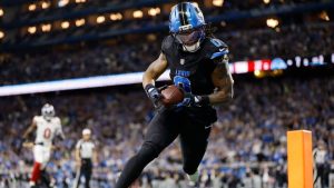Detroit Lions running back Jahmyr Gibbs (0) catches a touchdown pass against the New York Giants during the first half of an NFL football game in Detroit, Sunday, Nov. 23, 2025. (Rey Del Rio/AP)