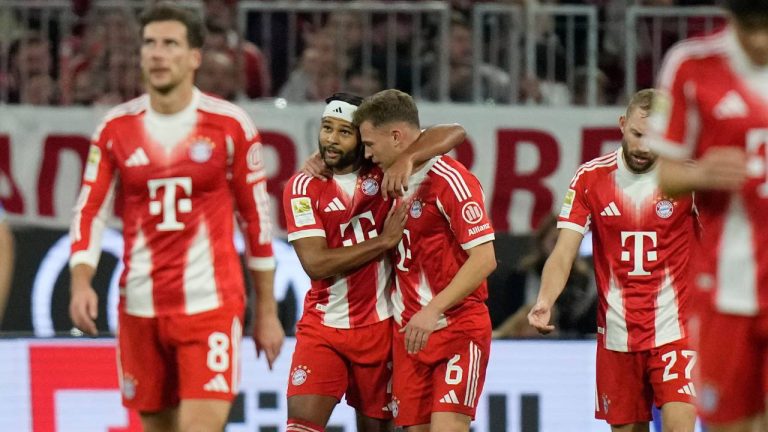 Bayern's Serge Gnabry, centre left, celebrates with Bayern's Joshua Kimmich after scoring his side's opening goal during the German Bundesliga soccer match between Bayern Munich and Bayern Leverkusen in Munich, Germany, Saturday, Nov. 1, 2025. (Matthias Schrader/AP)