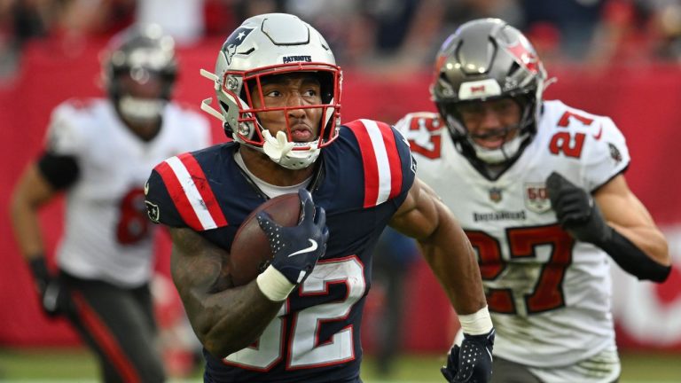 New England Patriots running back TreVeyon Henderson (32) runs for a touchdown against the Tampa Bay Buccaneers during the second half of an NFL football game Sunday, Nov. 9, 2025, in Tampa, Fla. (Jason Behnken/AP)