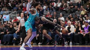 Toronto Raptors forward Brandon Ingram (3) drives into Charlotte Hornets forward Miles Bridges (0) during second half NBA basketball action in Toronto on Monday, November 17, 2025. (Nathan Denette/CP)