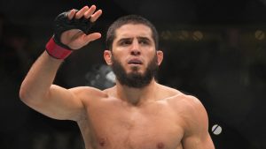 Islam Makhachev of Russia celebrates after he beats Alex Volkanovski of Australia in the UFC lightweight championship fight during UFC 294, at the Ethihad Arena in Abu Dhabi, United Arab Emirates, Saturday, Oct. 21, 2023. (AP Photo/Kamran Jebreili)