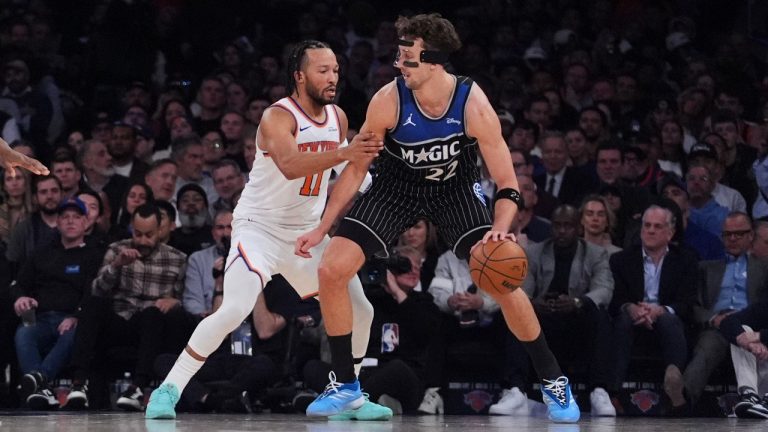 New York Knicks' Jalen Brunson (11) defends Orlando Magic's Franz Wagner (22) during the first half of an NBA basketball game Wednesday, Nov. 12, 2025, in New York. (AP Photo/Frank Franklin II)