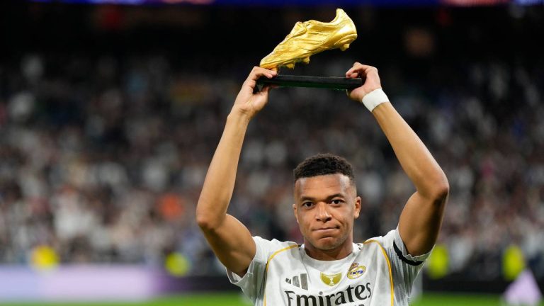 Real Madrid's Kylian Mbappe poses with the Golden Boot award before the Spanish La Liga soccer match between Real Madrid and Valencia in Madrid, Spain, Saturday, Nov. 1, 2025. (Manu Fernandez/AP)