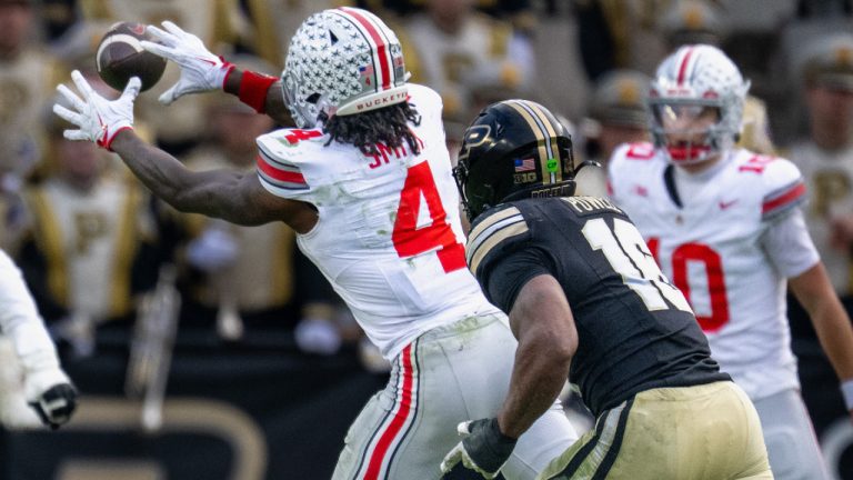 Ohio State wide receiver Jeremiah Smith (4) reaches for a pass during the second half of an NCAA college football game against Purdue, Saturday, Nov. 8, 2025, in West Lafayette, Ind. (Doug McSchooler/AP)