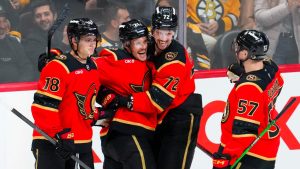 Ottawa Senators Nick Cousins (21) celebrates his third period goal with teammates Tim Stützle (18), Thomas Chabot (72) and David Perron (57) against the Boston Bruins in NHL hockey action in Ottawa on Monday, Oct. 27, 2025. (Sean Kilpatrick/CP)