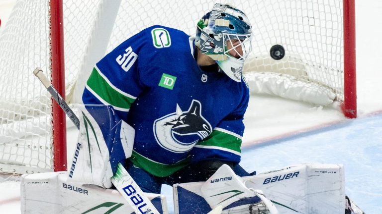 Calgary Flames' Jake Bean, not seen, scores on Vancouver Canucks goaltender Jiri Patera (30) during second period NHL pre-season hockey action in Abbotsford, B.C., on Wednesday September 25, 2024. (Ethan Cairns/CP)