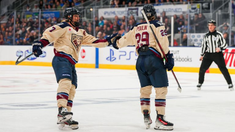 Montreal Victoire forwards Laura Stacey, left, and Marie-Philip Poulin celebrate a goal against the Toronto Sceptres in March 2025. (Photo by Thomas Skrlj/CP)