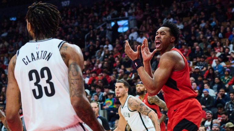 Toronto Raptors' Scottie Barnes (4) reacts after a block from Brooklyn Nets' Nic Claxton (33) during first half NBA basketball action in Toronto, on Sunday, Nov. 23, 2025. (Sammy Kogan/CP)
