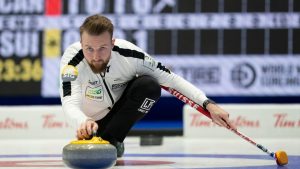 Swiss skip Yannick Schwaller makes a shot during semi-final action against Team Canada at the Men's World Curling Championship, Saturday, April 8, 2023 in Ottawa. (Adrian Wyld/CP)