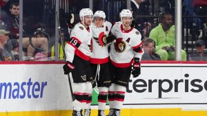 Ottawa Senators' Tim Stützle, centre, celebrates his game wining goal with Drake Batherson (19) and Thomas Chabot (72) during overtime in an NHL hockey game against the Philadelphia Flyers, Saturday, Nov. 8, 2025, in Philadelphia. (Derik Hamilton/AP)