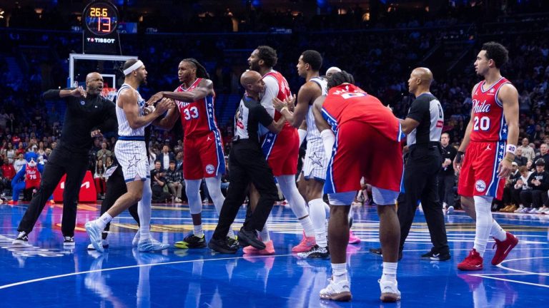 An incident on the court between Orlando Magic's Jalen Suggs, second from left, Philadelphia 76ers' Jabari Walker, third from right, and Andre Drummond, center, which leads to technicals and the ejection of Suggs during the first half of an NBA Cup basketball game, Tuesday, Nov. 25, 2025, in Philadelphia. (Chris Szagola/AP)