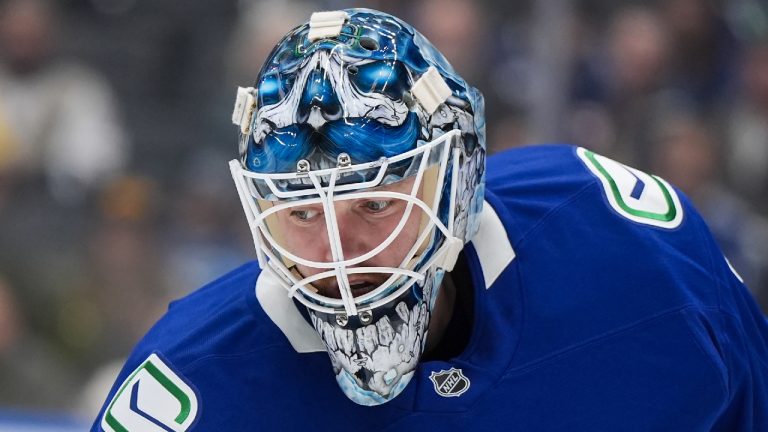 Vancouver Canucks goalie Thatcher Demko comes out of the net to play the puck during the first period of an NHL game against the Winnipeg Jets, in Vancouver, on Tuesday, November 11, 2025. (Darryl Dyck/CP)